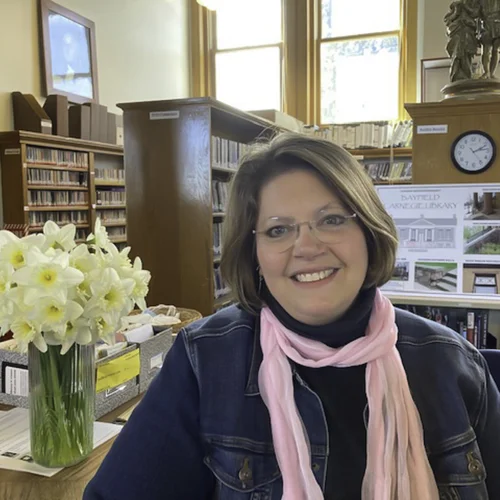 Teresa Weber smiling in library