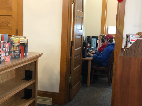 Computers in a room being used by two children