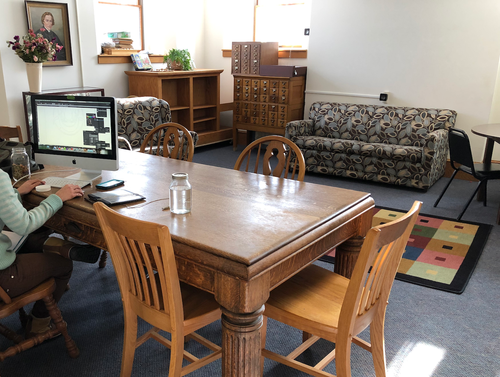 meeting-room Photo of the meeting room with a dining table, 3 seater couch, sofa chair and cabinets