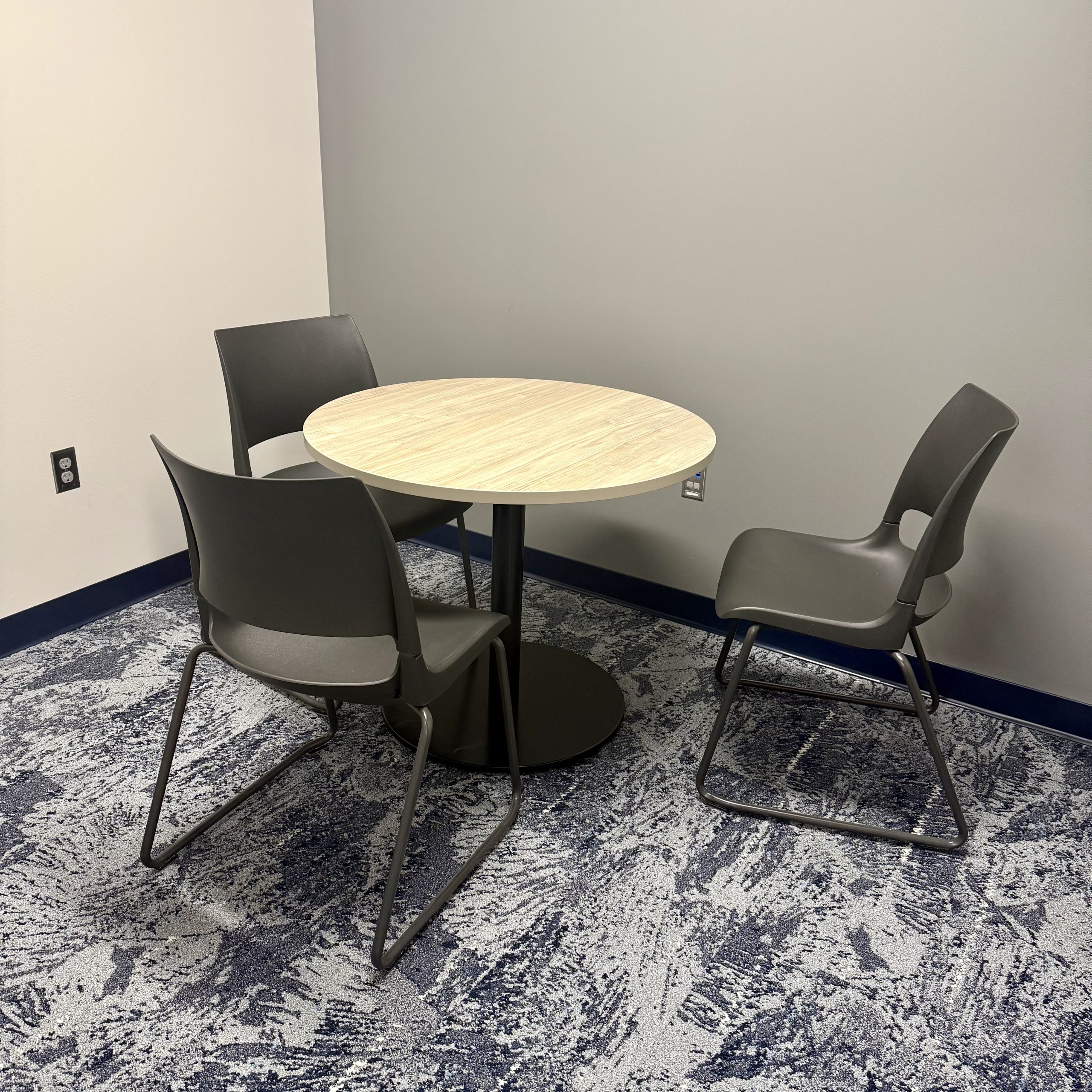 study room with round table and three chairs