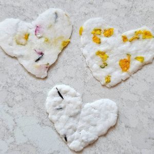 three hearts made of recycled seed paper