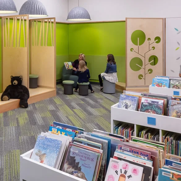 Superior public library children's area with a green painted wall